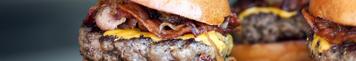 Eating American (Traditional) Burger at The Burger Stand at The Casbah restaurant in Lawrence, KS.